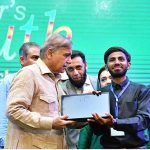 Prime Minister Muhammad Shehbaz Sharif distributes laptops among the high achievers of public sector universities under the PM's Youth Laptop Scheme at Bahauddin Zakaria University