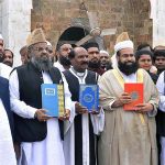 Special Assistant to the Prime Minister on Religious Harmony Maulana Tahir Ashrafi expressing solidarity with holy books at Jamia Manzoorul Islamia