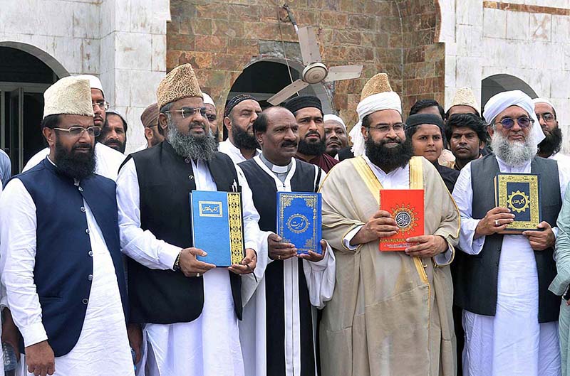 Special Assistant to the Prime Minister on Religious Harmony Maulana Tahir Ashrafi expressing solidarity with holy books at Jamia Manzoorul Islamia