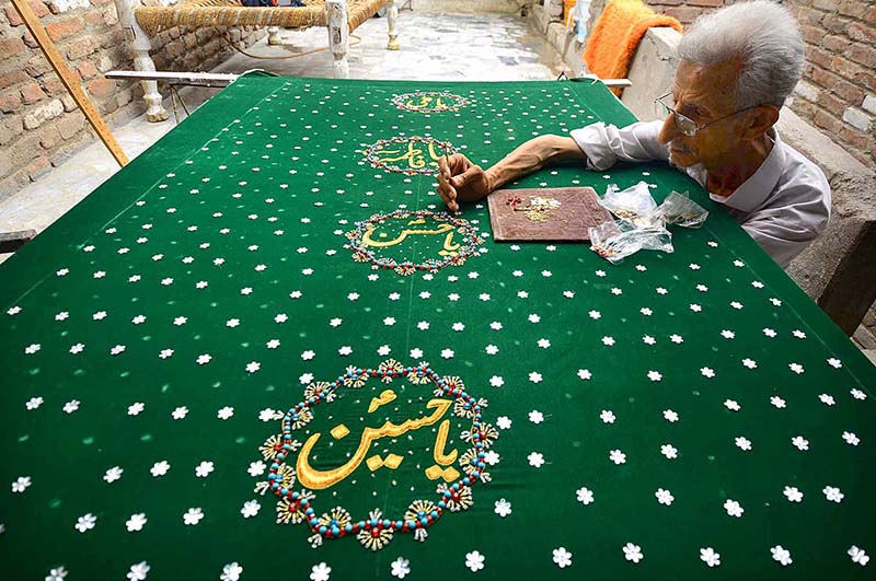 An old man preparing Muharram Procession related stuff in connection with the Holy Month of Muharram ul Harram