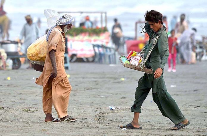 Street vendors selling candies for kids at sea view to earn bread and butter