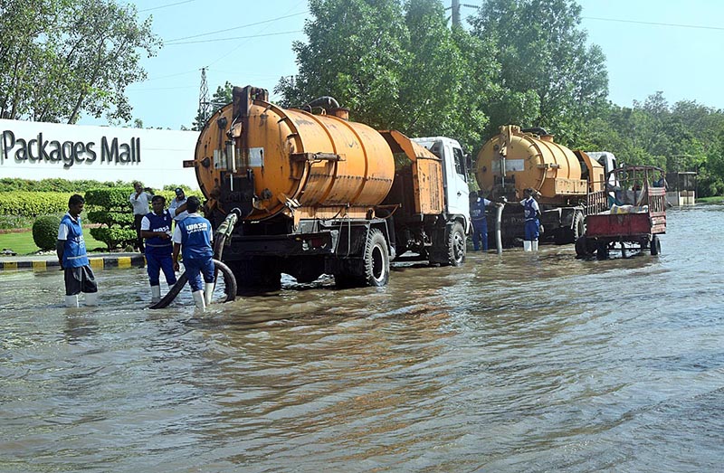 WASA employees are busy ensuring water drainage in the city by using modern missionaries