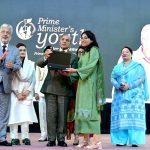 Prime Minister Muhammad Shehbaz Sharif distributing laptops among high achievers of public sector university students under the Prime Minister's Youth Laptop Scheme
