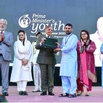 Prime Minister Muhammad Shehbaz Sharif distributing laptops among high achievers of public sector university students under the Prime Minister's Youth Laptop Scheme
