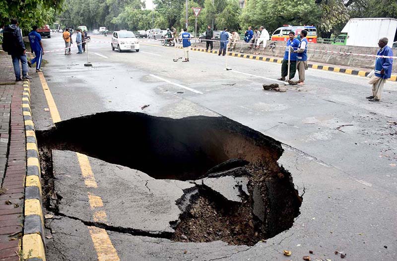 A view of New Muslim Town Canal road collapse due to heavy rain in the city