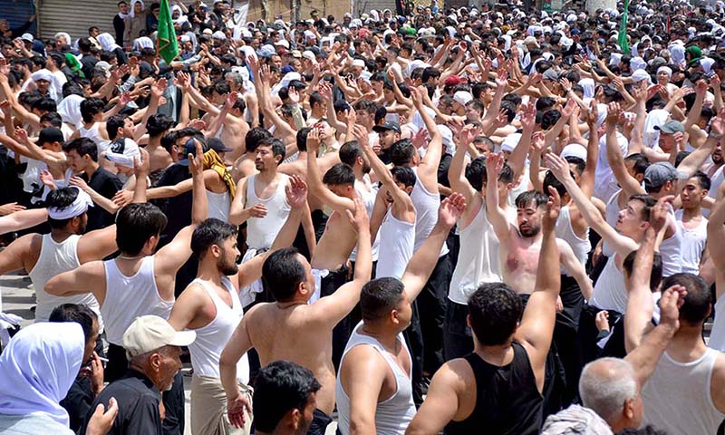 A large number of Shiite Muslims perform Zohrain prayers during the 10th Muharram procession to mark Ashoura at Meezan Chowk. Ashoura is the commemoration marking the Shahadat (death) of Hussein (AS), the grandson of the Prophet Muhammad (PBUH), with his family members during the battle of Karbala for the upright of Islam