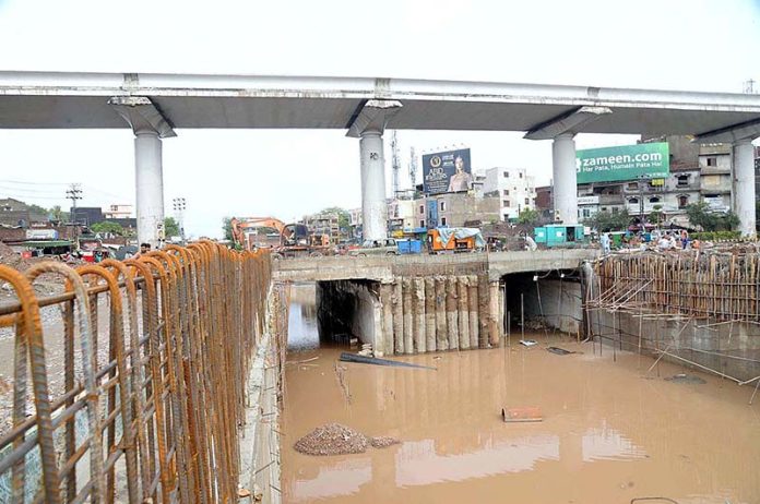 After heavy rain in the city, water has accumulated in the under-construction Samanabad Underpass