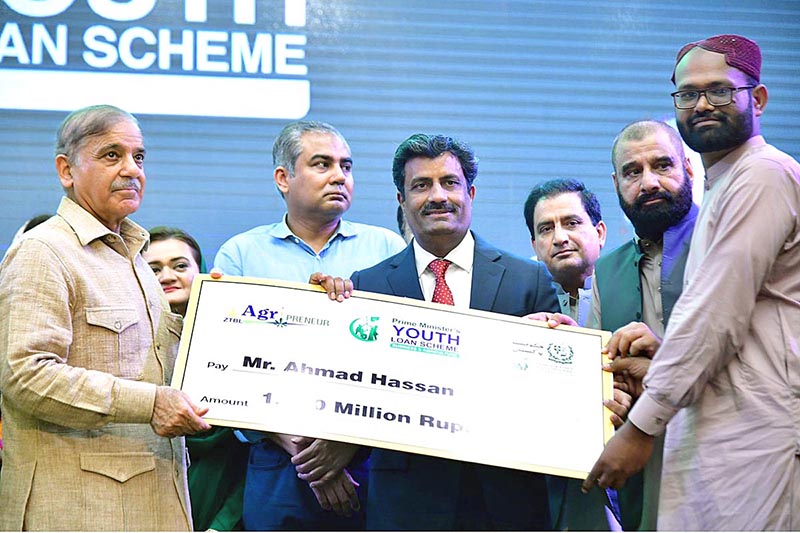 Prime Minister Muhammad Shehbaz Sharif distributes cheques among the successful candidates who received loans under Prime Minister's Youth Loan Scheme