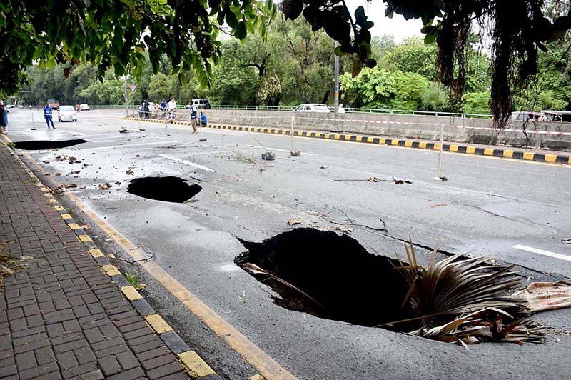 A view of New Muslim Town Canal road collapse due to heavy rain in the city