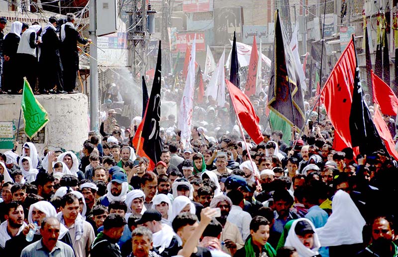 A large number of Shiite Muslims perform Zohrain prayers during the 10th Muharram procession to mark Ashoura at Meezan Chowk. Ashoura is the commemoration marking the Shahadat (death) of Hussein (AS), the grandson of the Prophet Muhammad (PBUH), with his family members during the battle of Karbala for the upright of Islam