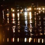 A view of reflections of vehicle’s headlights in water accumulated on road after heavy rain that experienced the Provincial Capital