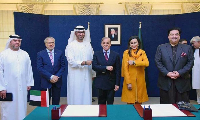 Prime Minister Muhammad Shehbaz Sharif UAE’s President-designate for COP28 Dr Sultan Ahmed Al Jaber , Federal Minister for climate change Ms Sherry Rehman displaying COP28’s wrist band as a display of commitment to climate change agency