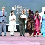 Prime Minister Muhammad Shehbaz Sharif distributing laptops among high achievers of public sector university students under the Prime Minister's Youth Laptop Scheme