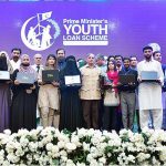 Prime Minister Muhammad Shehbaz Sharif in a group photo with high achievers who received laptops under the PM's Youth Laptop Scheme at Bahauddin Zakaria University