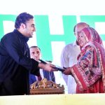 Chairman PPP and Foreign Minister Bilawal Bhutto Zardari handing over the land titles to flood affectees people in a ceremony at Dhamra Village