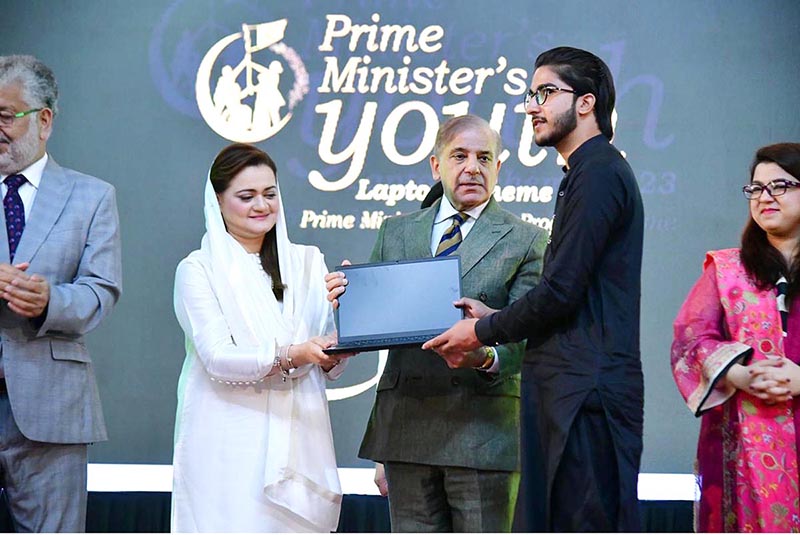 Prime Minister Muhammad Shehbaz Sharif distributing laptops among high achievers of public sector university students under the Prime Minister's Youth Laptop Scheme