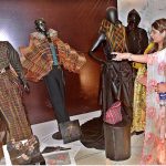 Visitors watching artworks during students of Textiles, Fashion & Interior Design, university of South Asia Al Hamra Hall