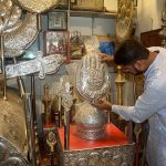A worker preparing Moharam ul Haram related stuff at his workplace