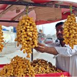 Road side vendor puts dates on display to attract the customer