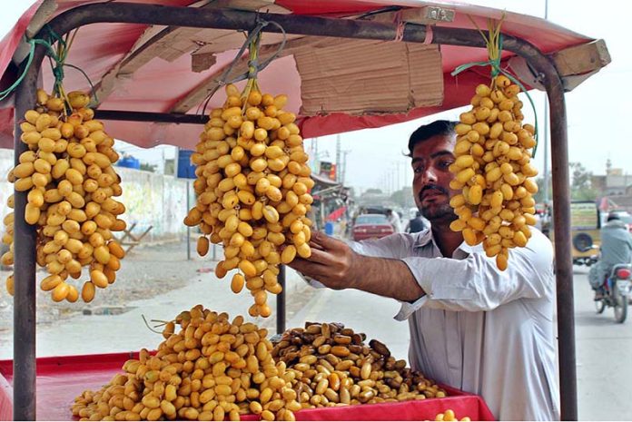 Road side vendor puts dates on display to attract the customer