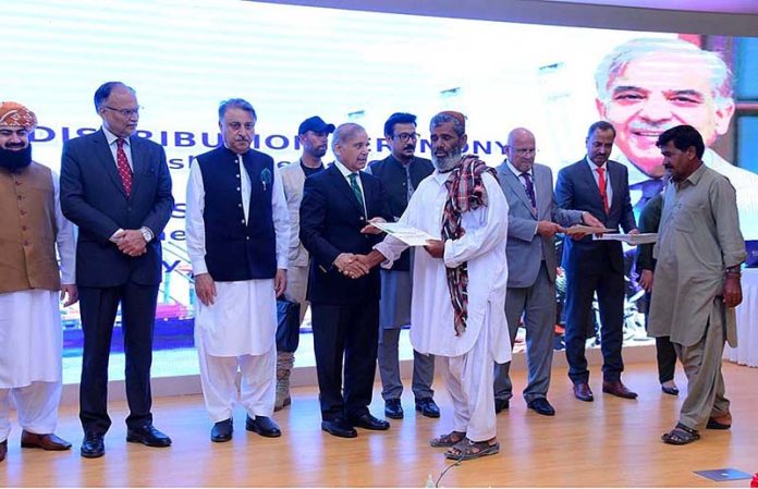 Prime Minister Muhammad Shehbaz Sharif distributes cheques among the fishermen of Gwadar