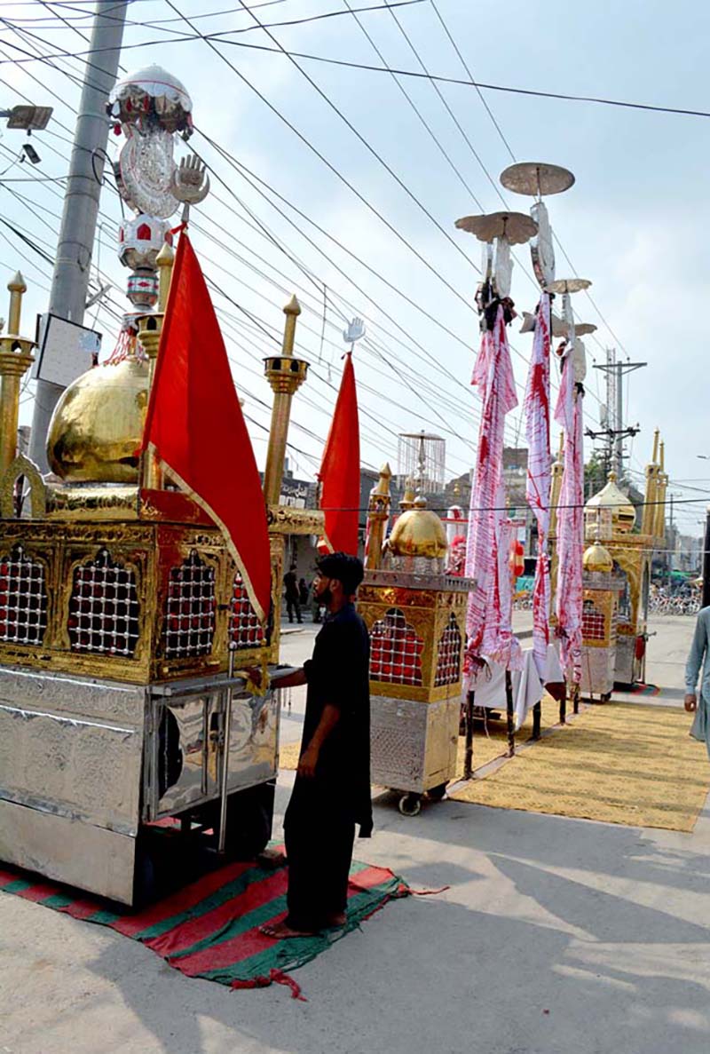 Vendors displaying Ashura related stuff during 9th Muharram-ul-Harram procession at Sharbat Chowk