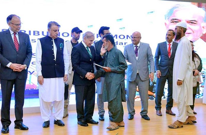 Prime Minister Muhammad Shehbaz Sharif distributes cheques among the fishermen of Gwadar
