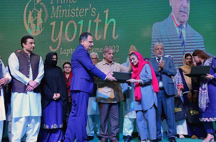 Prime Minister Muhammad Shehbaz Sharif distributes laptops among the high achievers of public sector universities under the PM’s Youth Laptop Scheme