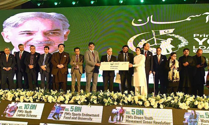 Prime Minister Muhammad Shehbaz Sharif distributing cheques among the recipients of Prime Minister’s Youth Business and Agriculture Loan Scheme at the Sindh Governor House