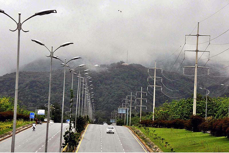 A view of clouds hovering over the Margalla Hills during rain in Federal Capital.
