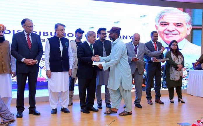 Prime Minister Muhammad Shehbaz Sharif distributes cheques among the fishermen of Gwadar