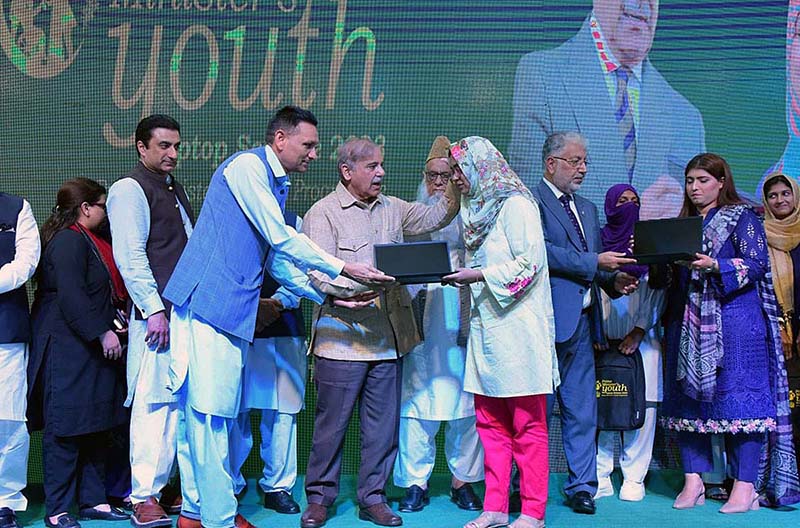 Prime Minister Muhammad Shehbaz Sharif distributes laptops among the high achievers of public sector universities under the PM’s Youth Laptop Scheme