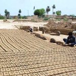 Labourers busy in preparing bricks at local bricks Kiln in Division
