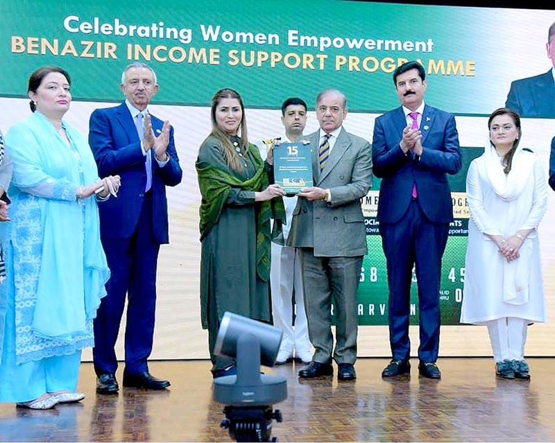 Minister for Poverty Alleviation and Social Protection Shazia Marri presenting a book on the 15 years journey of Benazir Income Support Program to Prime Minister Muhammad Shehbaz Sharif