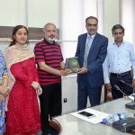 Director AIOU Professor Dr. Amir Shah presenting the shield to DG National Police Bureau Dr. Ehsan Sadiq after the seminar