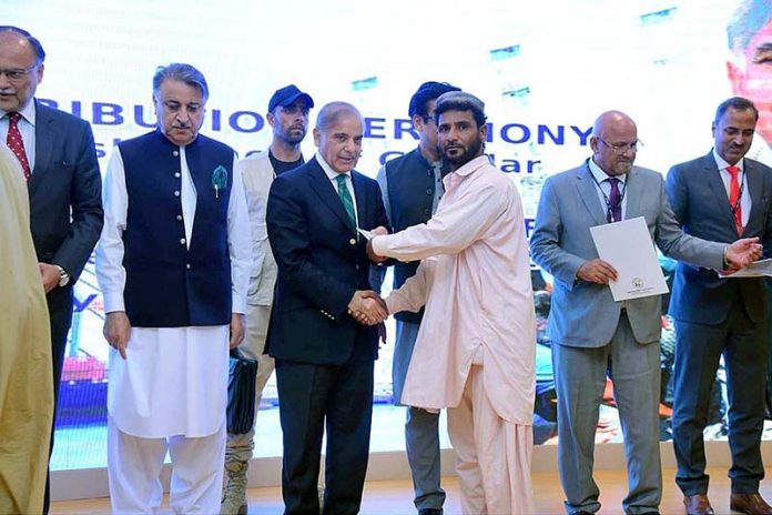 Prime Minister Muhammad Shehbaz Sharif distributes cheques among the fishermen of Gwadar