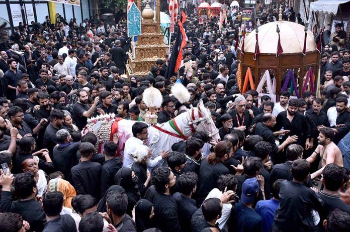 A large number of mourners attending the main procession of 9th Muharram-ul-Haram observing Youm-e-Ashur. Muharram ul Harram, the first month of the Islamic calendar is known as the mourning month to pay homage in remembrance of the martyrdom (Shahadat) of Hazrat Imam Hussain (AS), the grandson of the Holy Prophet Mohammad (SAWW), along with his family members and companions at the battle of Karbala