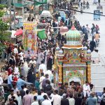 Devotees participate in the Tazia procession of Ashura on the 10th Muharram. Ashoura is the commemoration marking the Shahadat (death) of Hussein (AS), the grandson of the Prophet Muhammad (PBUH), with his family members and some of his companions massacred in battle of Karbala for the upright of Islam