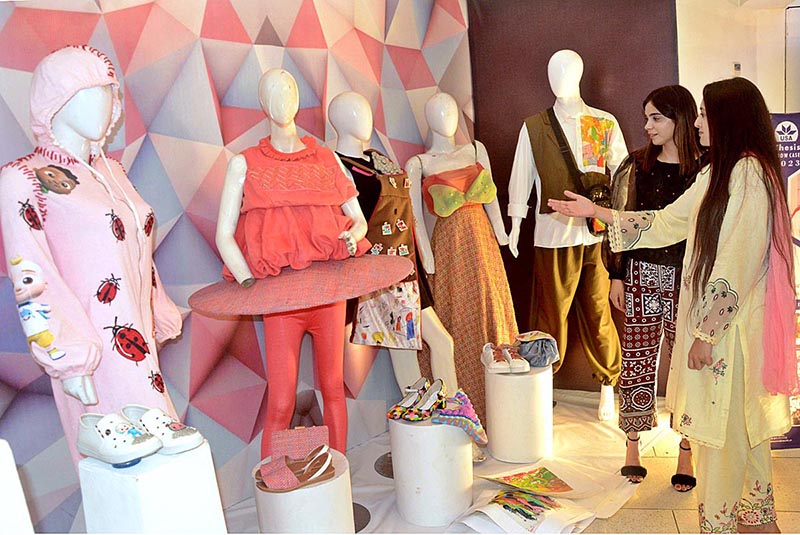Visitors taking keen interest in handmade crafts during an exhibition