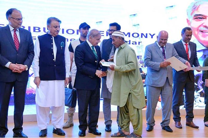 Prime Minister Muhammad Shehbaz Sharif distributes cheques among the fishermen of Gwadar