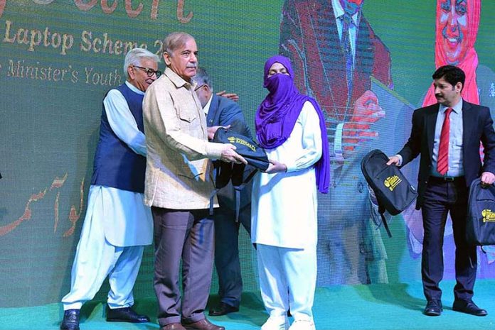 Prime Minister Muhammad Shehbaz Sharif distributes laptops among the high achievers of public sector universities under the PM’s Youth Laptop Scheme