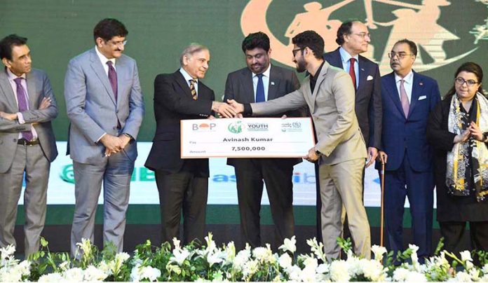 Prime Minister Muhammad Shehbaz Sharif distributing cheques among the successful candidates under PM's Youth Business Loan Scheme at Governor House