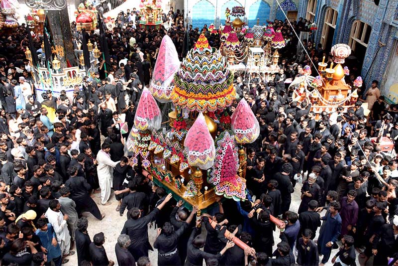 Mourners flagellate themselves with knifes on chains during the procession of Ashura on the 10th Muharram. Ashoura is the commemoration marking the Shahadat (death) of Hussein (AS), the grandson of the Prophet Muhammad (PBUH), with his family members and some of his companions massacred in battle of Karbala for the upright of Islam
