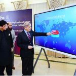 Prime Minister Muhammad Shehbaz Sharif pushing a button to inaugurate temporary Mobile Registration System for overseas Pakistanis & Foreign Nationals