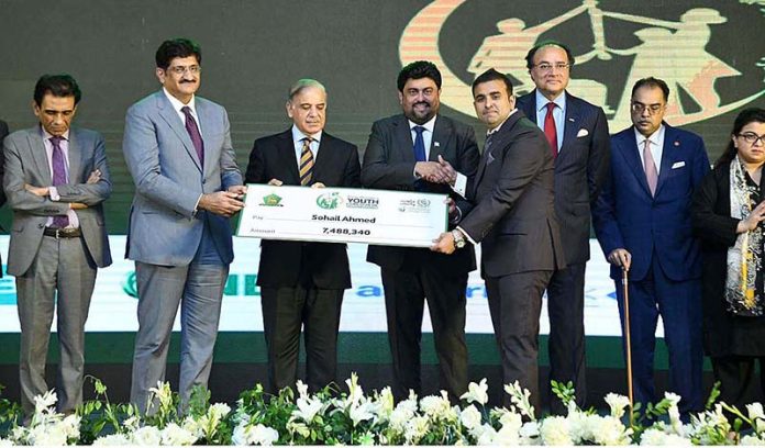 Prime Minister Muhammad Shehbaz Sharif distributing cheques among the successful candidates under PM's Youth Business Loan Scheme at Governor House