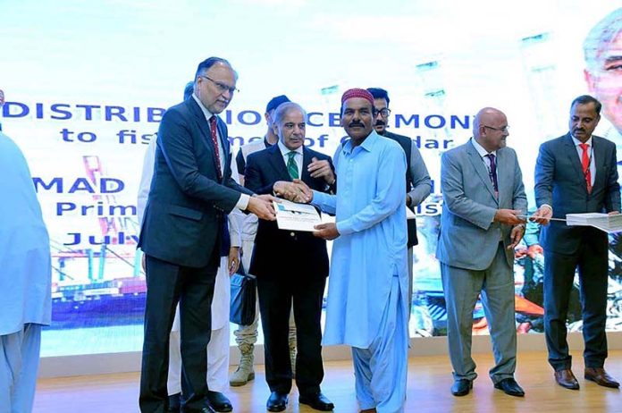 Prime Minister Muhammad Shehbaz Sharif distributes cheques among the fishermen of Gwadar