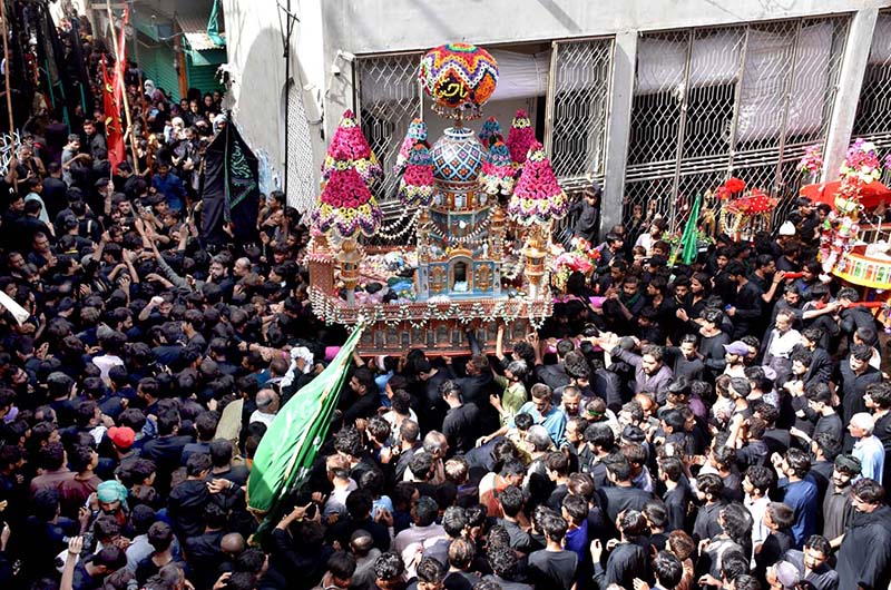Mourners flagellate themselves with knifes on chains during the procession of Ashura on the 10th Muharram. Ashoura is the commemoration marking the Shahadat (death) of Hussein (AS), the grandson of the Prophet Muhammad (PBUH), with his family members and some of his companions massacred in battle of Karbala for the upright of Islam