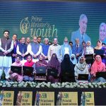 Prime Minister Muhammad Shehbaz Sharif in a group photo with high achievers who received laptops under the PM’s Youth Scheme distribution ceremony