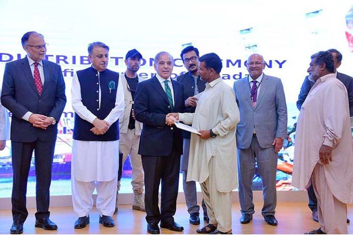 Prime Minister Muhammad Shehbaz Sharif distributes cheques among the fishermen of Gwadar