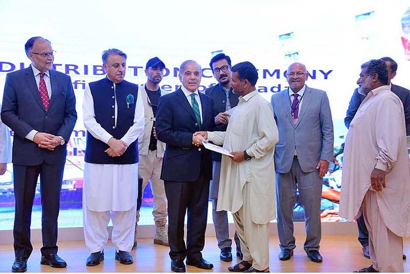 Prime Minister Muhammad Shehbaz Sharif distributes cheques among the fishermen of Gwadar